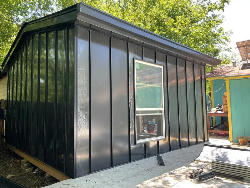 Black standing seam metal wall panels for Roof Inspection in Sealy